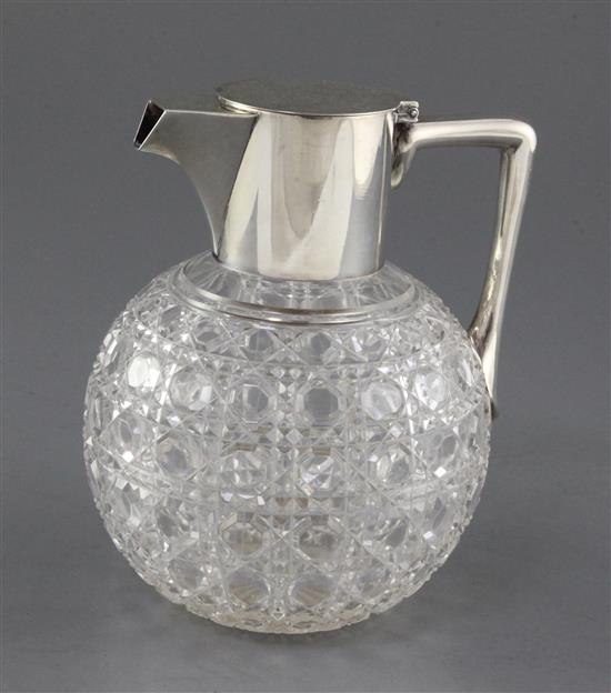 A late Victorian silver mounted cut glass claret jug by Hukin & Heath, in the manner of Christopher Dresser, height 16.5cm.